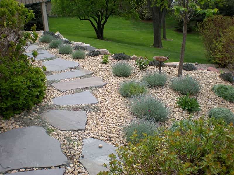 Beautiful Small Gravel Garden, Decorated with Light Brown Pebble in the  Middle, Brown Stone, Cactus, Green Leafs Ground Cover Stock Image - Image  of coarse, drop: 176765145