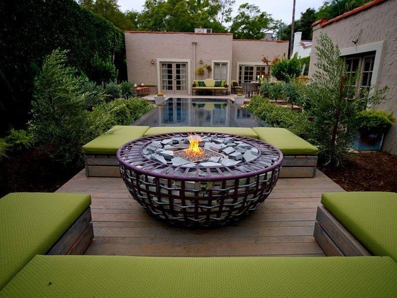 This solid stone fire pit marks out a small haven for relaxation in this  courtyard. Via Renoguide - Small backyard landscaping, Modern garden design,  Backyard